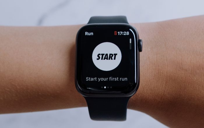 Close-up of a smartwatch displaying a running app